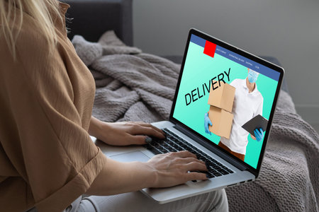 Online shopping. laptop with banner delivery