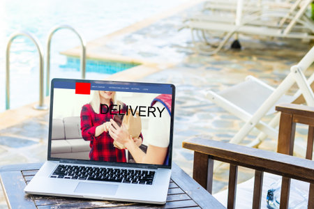 delivery icon on laptop keyboard. Online shopping, ecommerce and retail sale concept, delivery for...