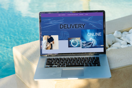 Online shopping website on laptop screen with female hands typingの写真素材