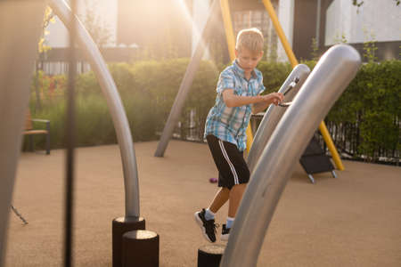 boy on the playground outdoors.の写真素材