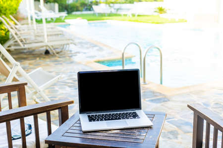 computer on table background as a pool.の写真素材