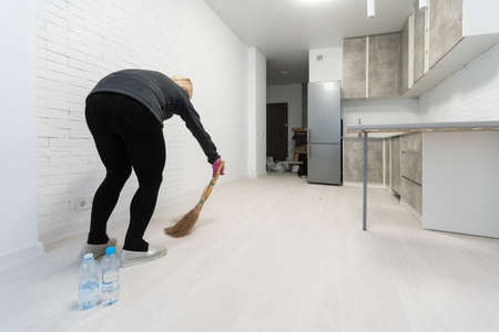 Cleaning lady in room after renovationの写真素材