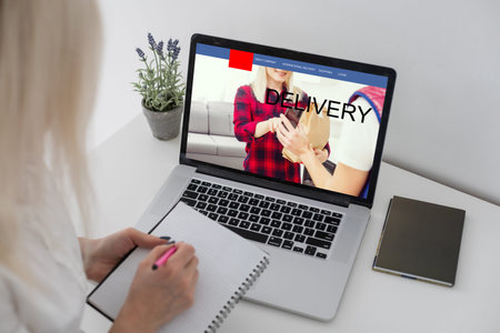 delivery icon on laptop keyboard. Online shopping, ecommerce and retail sale concept, delivery for...