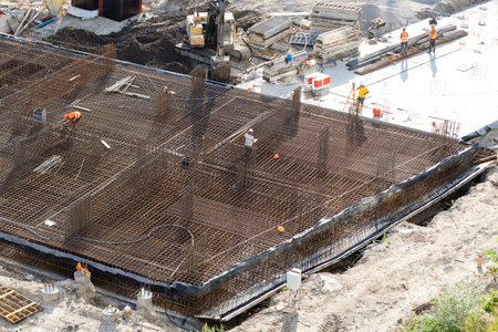 Closeup of house foundation made from concrete shuttering blocks filled with mortar and...