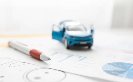 small car model and blueprint sheets.の写真素材