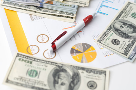money concept, graph, chart document and pen on desktop.の写真素材