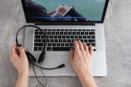 Psychological consultation online - man lists his problems - communicates with the patient using the digital technology - remote psychodiagnosis sessionの写真素材
