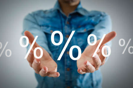 Discount Percentage Sign. Hand Showing Discount Percent.の写真素材