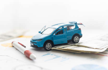 small car model and blueprint sheets.の写真素材