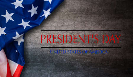 Happy presidents day concept with vintage flag of the United States on old stone backgroundの写真素材