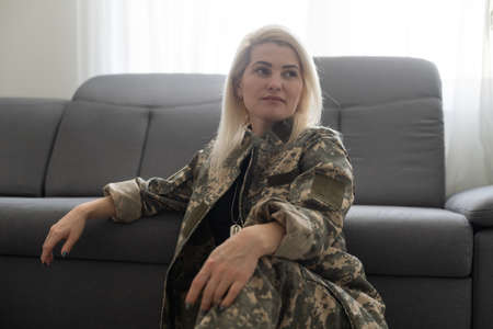 Photo of young woman happy positive smile soldier make selfie uniformの写真素材