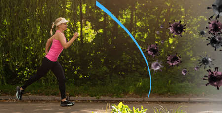 Portrait of young beautiful woman with virtual barrier to protect against contact with infectious materials at the streets.の写真素材