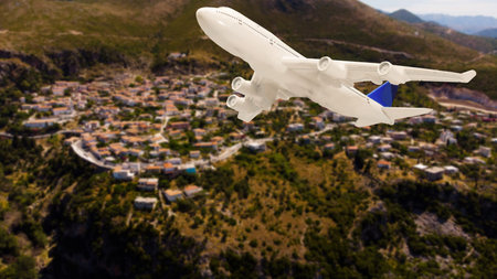 Aerial view of aircraft. Airplane is flying over mountains with forest. Business travel. Commercial planeの写真素材