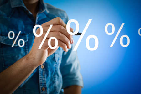 Discount Percentage Sign. Hand Showing Discount Percent.の写真素材