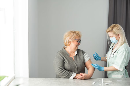 close up doctor holding syringe before make injection to patient in medical mask.