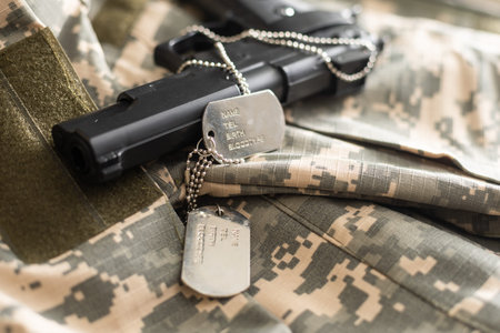 gun with dogtags. Concept of duty and service in US army forces. Veteran concept