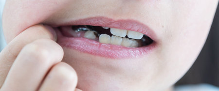 little girl with a plate on her teeth