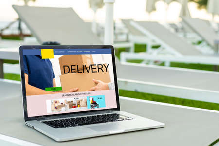 Laptop screen displaying a delivery tracking conceptの写真素材