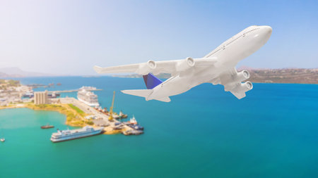 Aerial top down view of an airplane flying over blue sea as a travel concept with copy space
