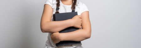 Portrait of a smiling little schoolgirlの写真素材