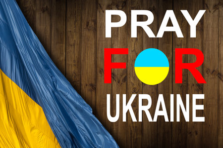 Ukraine flag. Pray for Ukraine. Ukraine flag in front of dark sky. Flag of Ukraine. Stop War. No War.の写真素材