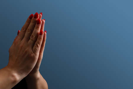 Praying hands with faith in religion and belief in God on blessing background. Power of hope or love and devotion.の写真素材