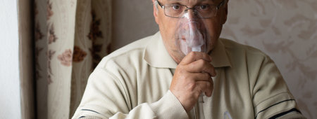 Elderly man on oxygen mask, nebulizerの写真素材