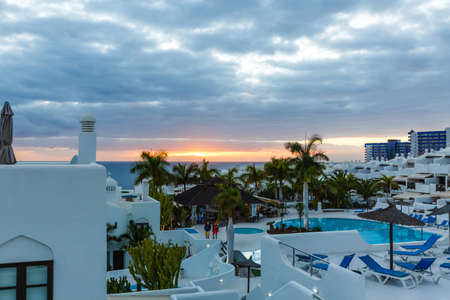 The view from the terraces of the beautiful sunset on the beachの写真素材