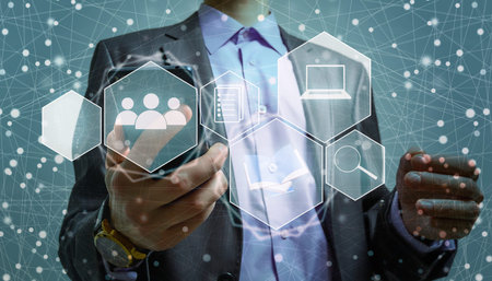 Internet and cybersecurity concept. A businessman is protecting personal data on mobile or...