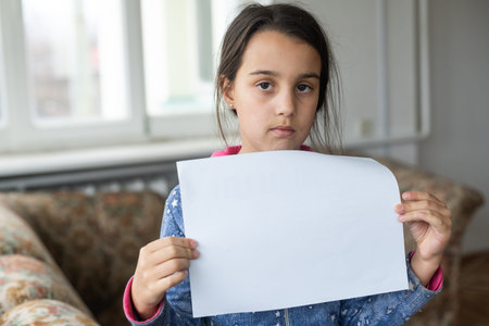 sad little girl with white sheet.