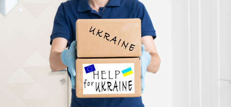 Humanitarian aid to Ukraine because of the war, Charity and assistance to people in need, refugee supportの写真素材