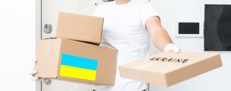 Volunteers collecting donations for the needs of Ukrainian migrants, humanitarian aid concept.