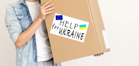 Collecting a humanitarian food set to help people who suffered during the war at the hands of Russia, stop the war in Ukraine, humanitarian aid 2022の写真素材
