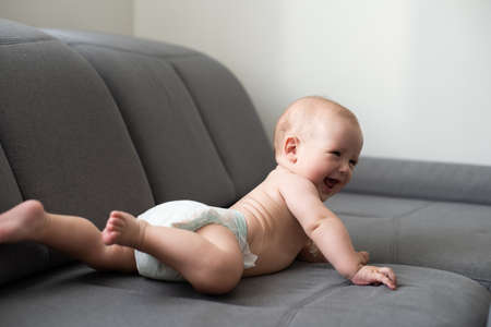 baby on the couch at homeの写真素材