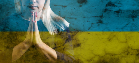 Flag of Ukraine and the face of a praying, a prayer for peace in Ukraine, Ukraine and the world