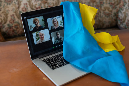laptop with video near the flag of ukraine