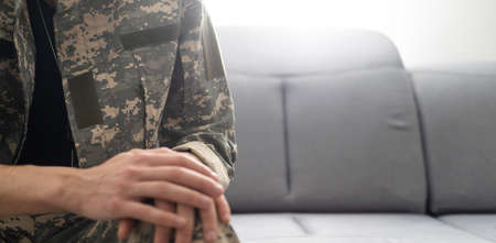Upset soldier remembering terrifying war, suffering ptsd, psychological help.の写真素材
