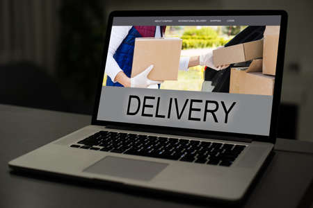 Laptop screen displaying a delivery tracking conceptの写真素材
