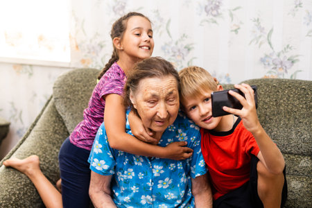 Great-grandmother with children. Family. school kid boy and little toddler girl. Happy senior old...