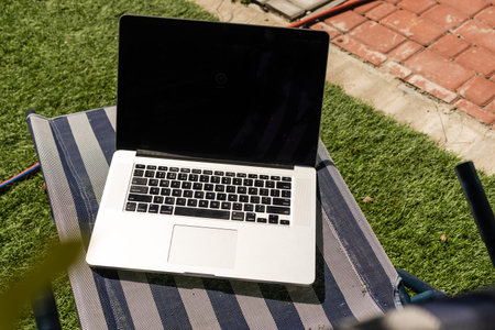 Laptop on nature, laptop in the garden.