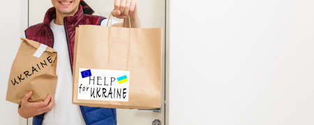 Humanitarian aid in Ukraine. Help to the poor. packages to pensioners and people with disabilities. war between Ukraine and Russia. Humanitarian aid concept. Donate for refugees.の写真素材