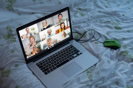 Virtual meeting online. Video conference by laptop. Online business meeting. On the laptop screen, people who gathered in a video conference to work on-lineの写真素材