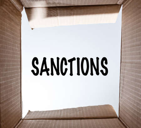 word Sanctions written on paper. the concept on the topic of sanctions in Russiaの写真素材