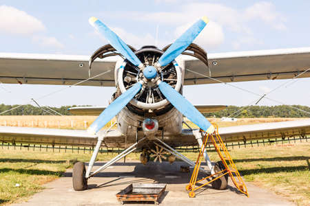 Small light airplane ready to flight on the airport field.の写真素材