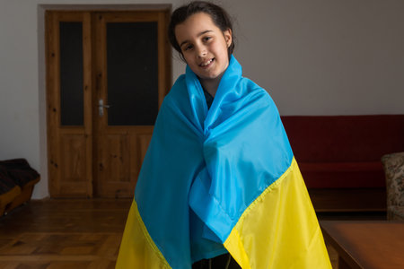 Pray for Ukraine. Child with Ukrainian flag. little girl with ukraine flagの写真素材