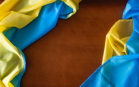 Flag of Ukraine and place for text on a dark wooden backgroundの写真素材