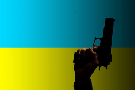 the flag of ukraine peoples hand holding handgun, illustrationの写真素材