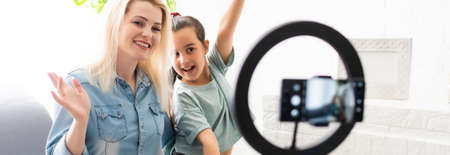 blogger woman records video with round lampの写真素材