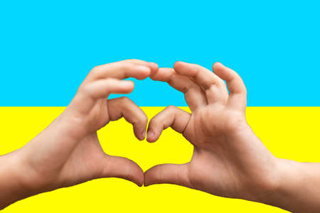 Love Ukraine concept. hands in heart form painted in Ukraine flag color - yellow and blue. Independence day of Ukraine, Flag, Constitution day Education, school, art painitng conceptの写真素材