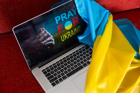 No war message on laptop. Ukraine vs Russia, conflict, cyber attack, invasion, army soldier. Hope for peace.の写真素材